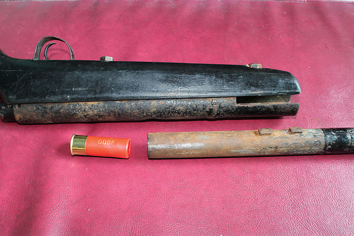 Loading a 12-gauge shotshell into the chamber required pulling the barrel from the receiver. The two lugs on the barrel engaged recesses in the receiver to lock the two together.